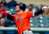 Houston Astros' Alex Bregman follows through as he watches his solo home run off Minnesota Twin pitcher Jose Berrios in the first inning of a baseball game Thursday, May 2, 2019, in Minneapolis. (AP Photo/Jim One)