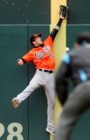 Baltimore Orioles' Trey Mancini tries but fails in his attempt to catch a foul ball off the bat of Minnesota Twins' Jorge Polanco in the third inning of a baseball game Saturday, April 27, 2019, in Minneapolis. (AP Photo/Jim Mone)