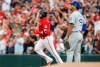 Minnesota Twins' Nelson Cruz, left, rounds the bases on a two-run home run off Kansas City Royals pitcher Glenn Sparkman, right, during the first inning of a baseball game Friday, Aug. 2, 2019, in Minneapolis. (AP Photo/Jim Mone)