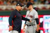 Cleveland Indians manager Terry Francona, left, checks on pitcher Adam Plutko, who was hit by a line drive off the bat of Minnesota Twins' Nelson Cruz during the fourth inning of a baseball game Friday, Sept 6, 2019, in Minneapolis. (AP Photo/Jim Mone)