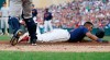 Minnesota Twins' Luis Arraez loses his helmet as he slides by New York Yankees catcher Austin Romine to score on a sacrifice fly by Jake Cave in the second inning of a baseball game Wednesday, July 24, 2019, in Minneapolis. (AP Photo/Jim Mone) 55
