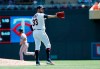 Minnesota Twins pitcher Martin Perez reaches for the ball after giving up a bases-loaded walk to Atlanta Braves' Johan Camargo in the third inning of a baseball game Wednesday, Aug. 7, 2019, in Minneapolis. (AP Photo/Jim Mone)