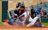 Toronto Blue Jays' Billy McKinney, right, beats the tag by Minnesota Twins catcher Willians Astudillo to score on a three-run, bases loaded double by Eric Sogard off Twins pitcher Michael Pineda in the fourth inning of a baseball game Thursday, April 18, 2019, in Minneapolis. (AP Photo/Jim Mone)