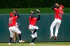 Minnesota Twins outfielders, from left, Eddie Rosario, Byron Buxton and Max Kepler celebrate with basketball-like shooting moves in the Twins 4-1 win over the Baltimore Orioles after a baseball game Sunday, April 28, 2019, in Minneapolis. The Twins won 4-1. Kepler and Buxton both hit home runs. (AP Photo/Jim Mone)