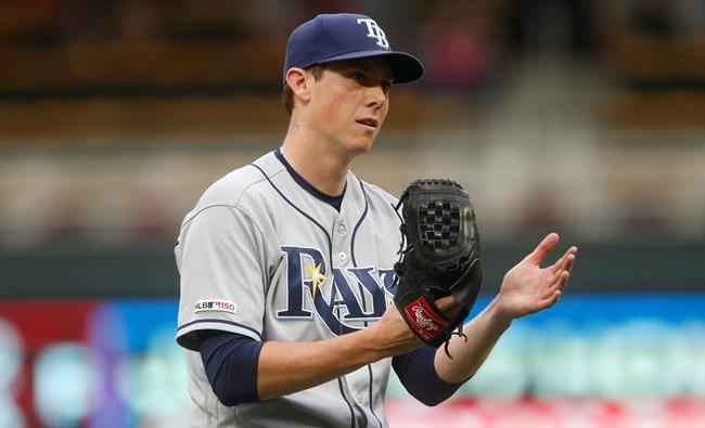 Tampa Bay Rays pitcher Ryan Yarbrough celebrates the final out of the 18th inning against the Minnesota Twins in Minneapolis. The Rays won 5-2. (AP Photo/Jim Mone)