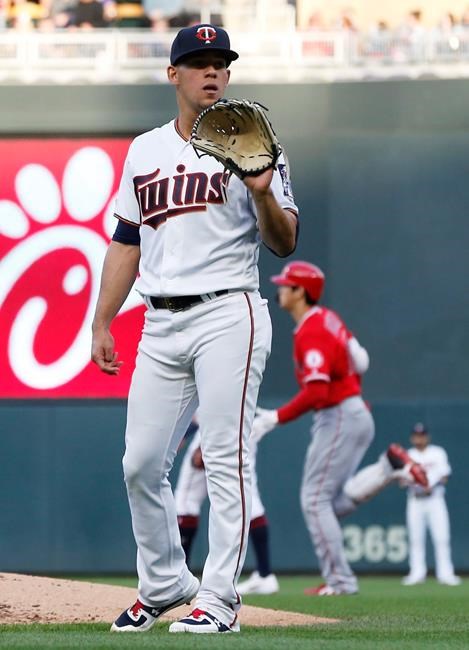 Los Angeles Angels' Shohei Ohtani, back second from right, runs the bases on a two-run home run off Minnesota Twins pitcher Jose Berrios, left, in the third inning of a baseball game Monday, May 13, 2019, in Minneapolis. (AP Photo/Jim Mone)