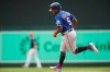 Texas Rangers' Willie Calhoun rounds the bases on a two-run home run off Minnesota Twins relief pitcher Tyler Duffey in the seventh inning of a baseball game Saturday, July 6, 2019, in Minneapolis. (AP Photo/Jim Mone)