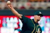 Oakland Athletics pitcher Blake Treinen throws against the Minnesota Twins in the eighth inning of a baseball game Saturday, July 20, 2019, in Minneapolis. (AP Photo/Jim Mone)