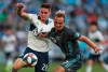 Vancouver Whitecaps defenseman Jake Nerwinski (28) jostles with Minnesota United midfielder Collin Martin (17) for the ball during the first half of an MLS soccer game Saturday July 27, 2019 at Allianz Field in St. Paul, Minn. (Alex Kormann/Star Tribune via AP)