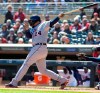 Detroit Tigers designated hitter Miguel Cabrera (24) follows through on a single against the Minnesota Twins during the first inning of a baseball game Sunday, April 14, 2019, in Minneapolis. (AP Photo/Paul Battaglia)