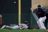 Detroit Tigers' Gordon Beckham slides back to first base against Minnesota Twins' C.J. Cron in the ninth inning of a baseball game Saturday, April 13, 2019 in Minneapolis. The Twins won 4-3. (AP Photo/Stacy Bengs)