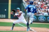 Minnesota Twins' Ehire Adrianza catches the ball at first to get out Kansas City Royals' Billy Hamilton after he bunted a ground ball during the fifth inning of a baseball game Sunday, June 16, 2019, in Minneapolis. Adrianza caught the ball from pitcher Martin Perez. (AP Photo/Stacy Bengs)