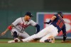 Atlanta Braves' Johan Camargo, left, gets out Minnesota Twins' Jason Castro at second base after catching the ball from right fielder Ronald Acuna during the fifth inning of a baseball game Monday, Aug. 5, 2019, in Minneapolis. (AP Photo/Stacy Bengs)