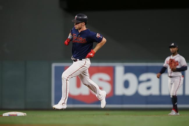 Minnesota Twins' Max Kepler runs toward second base after hitting a home run against the Atlanta Braves during the fifth inning of a baseball game Monday, Aug. 5, 2019, in Minneapolis. (AP Photo/Stacy Bengs)
