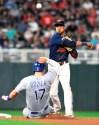 Minnesota Twins shortstop Jorge Polanco throws to first after forcing out Kansas City Royals' Hunter Dozier (17) during the sixth inning of a baseball game Saturday, Sept. 21, 2019, in Minneapolis. Alex Gordon was out at first. Kansas City won 12-5. (AP Photo/Tom Olmscheid)