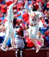 St. Louis Cardinals' Marcell Ozuna (23) is congratulated by Matt Carpenter after his three run home run against the Cincinnati Reds in the third inning of a baseball game, Saturday, April 27, 2019 in St. Louis. (AP Photo/Bill Boyce)