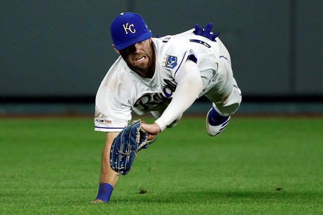 Kansas City Royals center fielder Bubba Starling makes a diving catch on a fly ball hit by Cleveland Indians' Mike Freeman in the sixth inning of a baseball game at Kauffman Stadium in Kansas City, Mo., Friday, July 26, 2019. (AP Photo/Colin E. Braley)