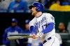 Kansas City Royals' Hunter Dozier watches his two-run triple against the Los Angeles Angels in the fifth inning of a baseball game at Kauffman Stadium in Kansas City, Mo., Saturday, April 27, 2019. (AP Photo/Colin E. Braley)