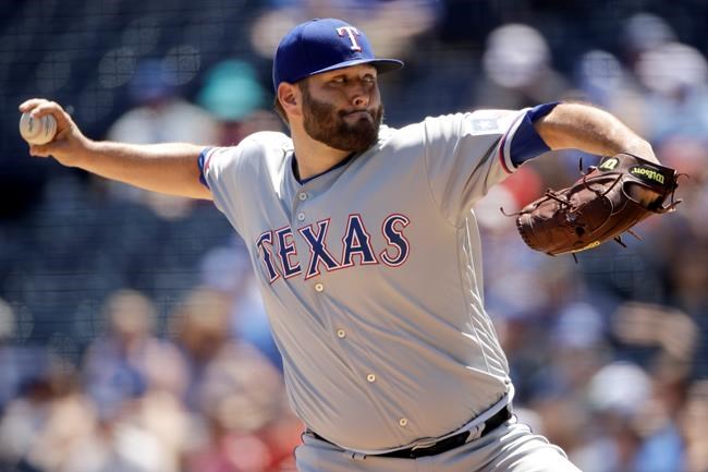 Texas Rangers starting pitcher Lance Lynn throws during the first inning of a baseball game against the Kansas City Royals, Thursday, May 16, 2019, in Kansas City, Mo. (AP Photo/Charlie Riedel)