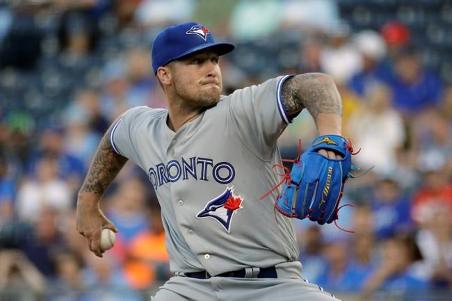Toronto Blue Jays starting pitcher Sean Reid-Foley throws during the first inning of a baseball game against the Kansas City Royals Tuesday, July 30, 2019, in Kansas City, Mo. (AP Photo/Charlie Riedel)