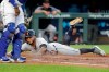 Detroit Tigers' Harold Castro slides home to score on a single by Dawel Lugo during the second inning of the team's baseball game against the Kansas City Royals on Wednesday, Sept. 4, 2019, in Kansas City, Mo. (AP Photo/Charlie Riedel)