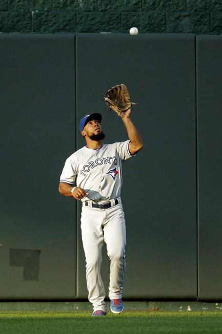 Toronto Blue Jays center fielder Teoscar Hernandez catches a fly ball hit by Kansas City Royals' Cheslor Cuthbert to end the first inning of a baseball game Tuesday, July 30, 2019, in Kansas City, Mo. (AP Photo/Charlie Riedel)