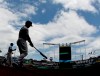 New York Yankees' Luke Voit, second from left, and Aaron Hicks warm up before batting in the first inning of the first baseball game in a double header against the Kansas City Royals, Saturday, May 25, 2019, in Kansas City, Mo. (AP Photo/Charlie Riedel)