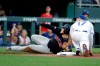 Cleveland Indians' Roberto Perez beats the tag by Kansas City Royals third baseman Hunter Dozier (17) on a triple during the third inning of a baseball game Wednesday, July 3, 2019, in Kansas City, Mo. (AP Photo/Charlie Riedel)