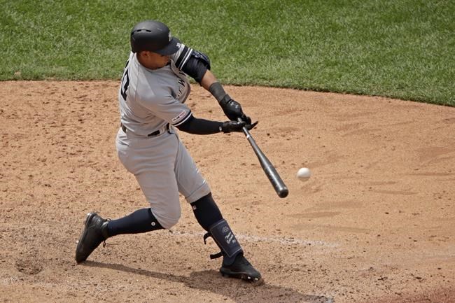 New York Yankees' Thairo Estrada hits a two-run double during the eighth inning of the first baseball game in a doubleheader against the Kansas City Royals, Saturday, May 25, 2019, in Kansas City, Mo. (AP Photo/Charlie Riedel)