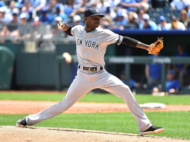 CORRECTS THE YEAR TO 2019, NOT 2018 AS ORIGINALLY SENT - New York Yankees starting pitcher Domingo German throws in the first inning against the Kansas City Royals during a baseball game Sunday, May 26, 2019, in Kansas City, Mo. (AP Photo/Ed Zurga)