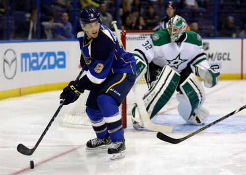 St. Louis Blues' Jaden Schwartz (9) looks to pass as Dallas Stars goalie Kari Lehtonen, of Finland, defends during the second period of a preseason NHL hockey game Saturday, Sept. 21, 2013, in St. Louis. (AP Photo/Jeff Roberson)