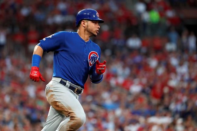 Chicago Cubs' Willson Contreras rounds first on a single during the third inning of the team's baseball game against the St. Louis Cardinals on Wednesday, July 31, 2019, in St. Louis. Contreras was tagged out at second trying to stretch the single into a double. (AP Photo/Jeff Roberson)