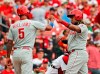 Philadelphia Phillies' Nick Williams (5) and Maikel Franco celebrate after scoring on a double by Cesar Hernandez during the fifth inning of a baseball game against the St. Louis Cardinals Wednesday, May 8, 2019, in St. Louis. (AP Photo/Jeff Roberson)