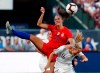 United States' Alex Morgan (13) and New Zealand's Katie Duncan (16) vie for the ball during the first half of an international friendly soccer match Thursday, May 16, 2019, in St. Louis. (AP Photo/Jeff Roberson)