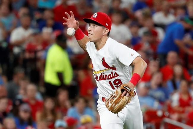St. Louis Cardinals third baseman Tommy Edman misplays a ball hit by Chicago Cubs' Kris Bryant during the sixth inning of a baseball game Wednesday, July 31, 2019, in St. Louis. Bryant reached base safely and Edman was charged with a fielding error on the play. (AP Photo/Jeff Roberson)