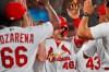 St. Louis Cardinals' Paul Goldschmidt (46) is congratulated by teammates in the dugout after hitting a grand slam during the third inning of a baseball game against the Milwaukee Brewers, Friday, Sept. 13, 2019, in St. Louis. (AP Photo/Jeff Roberson)