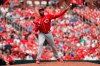 Cincinnati Reds relief pitcher Amir Garrett throws the ball away in a failed attempt to pick off St. Louis Cardinals' Dexter Fowler during the eighth inning in the first baseball game of a doubleheader Sunday, Sept. 1, 2019, in St. Louis. Fowler went on to second on the play and scored later in the inning. (AP Photo/Jeff Roberson)