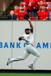 Milwaukee Brewers center fielder Lorenzo Cain leaps to catch a fly ball by St. Louis Cardinals' Yadier Molina during the sixth inning of a baseball game Wednesday, April 24, 2019, in St. Louis. (AP Photo/Jeff Roberson)
