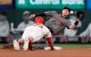 St. Louis Cardinals' Yairo Munoz is out trying to steal second as Arizona Diamondbacks shortstop Nick Ahmed (13) handles the throw during the sixth inning of a baseball game Saturday, July 13, 2019, in St. Louis. (AP Photo/Jeff Roberson)