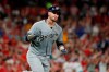 Milwaukee Brewers' Yasmani Grandal pumps his fist as he rounds the bases after hitting a two-run home run during the eighth inning of a baseball game against the St. Louis Cardinals, Saturday, Sept. 14, 2019, in St. Louis. (AP Photo/Jeff Roberson)