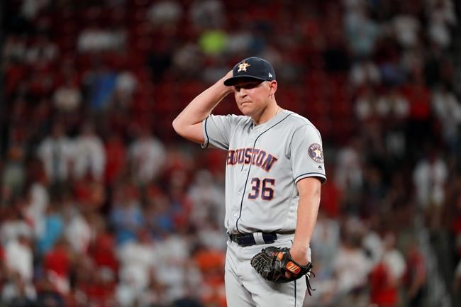Houston Astros relief pitcher Will Harris pauses after giving up a solo home run to St. Louis Cardinals' Matt Wieters during the seventh inning of a baseball game Friday, July 26, 2019, in St. Louis. (AP Photo/Jeff Roberson)