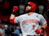 Cincinnati Reds' Jose Peraza celebrates as he reaches home on a solo home run during the ninth inning of a baseball game Friday, April 26, 2019, in St. Louis. (AP Photo/Jeff Roberson)