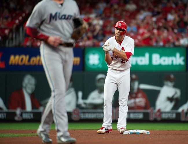St. Louis Cardinals starting pitcher Jack Flaherty celebrates as he stands on second base after hitting a double during the third inning of the team's baseball game against the Miami Marlins, Tuesday, June 18, 2019, in St. Louis. (AP Photo/L.G. Patterson)