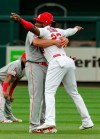 Los Angeles Angels' Albert Pujols, left, picks up St. Louis Cardinals' Marcell Ozuna, right, as they talk on the field before the start of a baseball game Friday, June 21, 2019, in St. Louis. (AP Photo/L.G. Patterson)