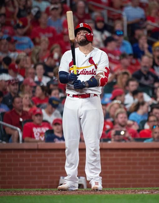 St. Louis Cardinals catcher Yadier Molina grimaces after a strike during the seventh inning of the team's baseball game against the Miami Marlins, Tuesday, June 18, 2019, in St. Louis. (AP Photo/L.G. Patterson)