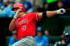 Los Angeles Angels' Albert Pujols hits a two-run double off Kansas City Royals starting pitcher Homer Bailey during the first inning of a baseball game at Kauffman Stadium in Kansas City, Mo., Sunday, April 28, 2019. (AP Photo/Orlin Wagner)