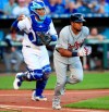 Kansas City Royals catcher Martin Maldonado, left, completes the strike out of Detroit Tigers' Jeimer Candelario during the first inning of a baseball game at Kauffman Stadium in Kansas City, Mo., Friday, July 12, 2019. (AP Photo/Orlin Wagner)