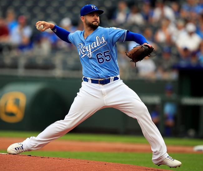 Kansas City Royals starting pitcher Jakob Junis delivers to a Toronto Blue Jays batter during the first inning of a baseball game at Kauffman Stadium in Kansas City, Mo., Wednesday, July 31, 2019. (AP Photo/Orlin Wagner)