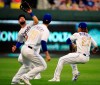 Kansas City Royals left fielder Alex Gordon, right, zeros in and catches a fly ball hit by Chicago White Sox Yoan Moncada during the third inning of a baseball game at Kauffman Stadium in Kansas City, Mo., Friday, June 7, 2019. Kansas City Royals third baseman Cheslor Cuthbert (19) and shortstop Adalberto Mondesi (27) avoid a collision on the play. (AP Photo/Orlin Wagner)