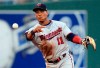 Minnesota Twins shortstop Jorge Polanco throws to first on a grounder by Kansas City Royals' Humberto Arteaga during the first inning of a baseball game at Kauffman Stadium in Kansas City, Mo., Friday, June 21, 2019. Arteaga was safe on a throwing error by Polanco and a run scored on the play. (AP Photo/Orlin Wagner)